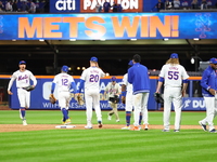 The New York Mets celebrate after their 7-2 win in Game 3 of a baseball NL Division Series against the Philadelphia Phillies at Citi Field i...