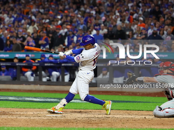 Francisco Lindor #12 of the New York Mets doubles during the eighth inning in Game 3 of a baseball NL Division Series against the Philadelph...