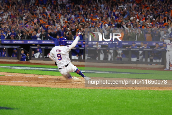 Brandon Nimmo #9 of the New York Mets scores during the seventh inning in Game 3 of a baseball NL Division Series against the Philadelphia P...