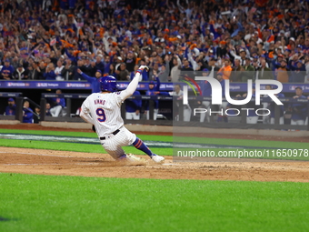 Brandon Nimmo #9 of the New York Mets scores during the seventh inning in Game 3 of a baseball NL Division Series against the Philadelphia P...