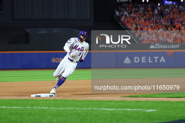 Brandon Nimmo #9 of the New York Mets scores during the seventh inning in Game 3 of a baseball NL Division Series against the Philadelphia P...