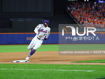 Brandon Nimmo #9 of the New York Mets scores during the seventh inning in Game 3 of a baseball NL Division Series against the Philadelphia P...