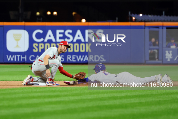 Harrison Bader #44 of the New York Mets steals second base during the seventh inning in Game 3 of a baseball NL Division Series against the...