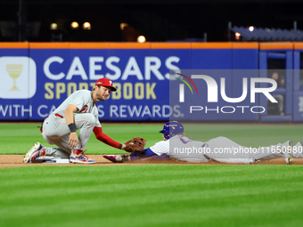 Harrison Bader #44 of the New York Mets steals second base during the seventh inning in Game 3 of a baseball NL Division Series against the...