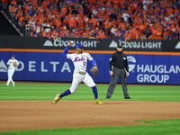 New York Mets shortstop Francisco Lindor #12 fields and throws during the seventh inning in Game 3 of a baseball NL Division Series against...