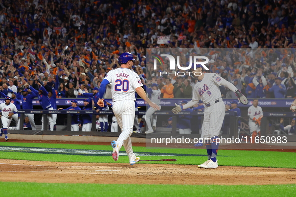 Pete Alonso #20 of the New York Mets scores during the sixth inning in Game 3 of a baseball NL Division Series against the Philadelphia Phil...