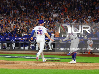 Pete Alonso #20 of the New York Mets scores during the sixth inning in Game 3 of a baseball NL Division Series against the Philadelphia Phil...