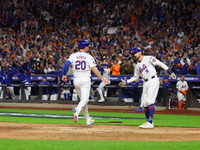 Pete Alonso #20 of the New York Mets scores during the sixth inning in Game 3 of a baseball NL Division Series against the Philadelphia Phil...