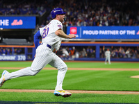 Pete Alonso #20 of the New York Mets scores during the sixth inning in Game 3 of a baseball NL Division Series against the Philadelphia Phil...