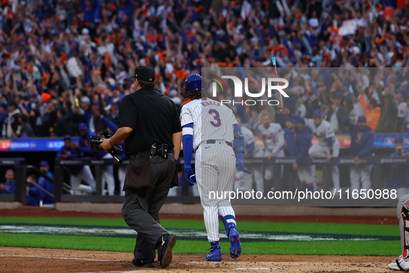 Jesse Winker #3 of the New York Mets hits a solo home run during the fourth inning in Game 3 of a baseball NL Division Series against the Ph...