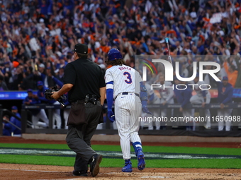 Jesse Winker #3 of the New York Mets hits a solo home run during the fourth inning in Game 3 of a baseball NL Division Series against the Ph...