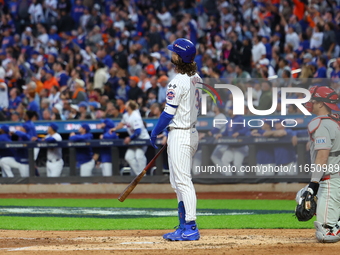 Jesse Winker #3 of the New York Mets hits a solo home run during the fourth inning in Game 3 of a baseball NL Division Series against the Ph...