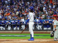 Jesse Winker #3 of the New York Mets hits a solo home run during the fourth inning in Game 3 of a baseball NL Division Series against the Ph...