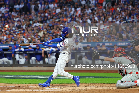 Jesse Winker #3 of the New York Mets hits a solo home run during the fourth inning in Game 3 of a baseball NL Division Series against the Ph...