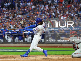 Jesse Winker #3 of the New York Mets hits a solo home run during the fourth inning in Game 3 of a baseball NL Division Series against the Ph...