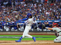 Jesse Winker #3 of the New York Mets hits a solo home run during the fourth inning in Game 3 of a baseball NL Division Series against the Ph...