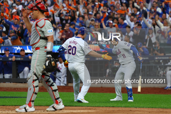 Pete Alonso #20 of the New York Mets rounds the bases after homering during the second inning in Game 3 of a baseball NL Division Series aga...