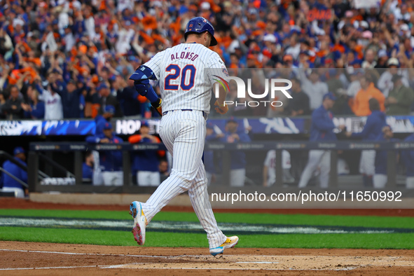 Pete Alonso #20 of the New York Mets rounds the bases after homering during the second inning in Game 3 of a baseball NL Division Series aga...