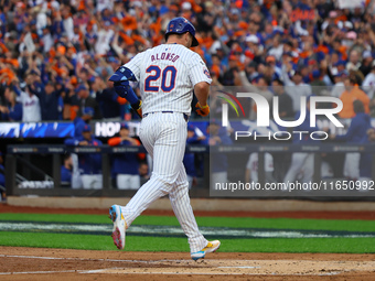 Pete Alonso #20 of the New York Mets rounds the bases after homering during the second inning in Game 3 of a baseball NL Division Series aga...