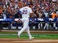 Pete Alonso #20 of the New York Mets rounds the bases after homering during the second inning in Game 3 of a baseball NL Division Series aga...