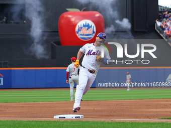 Pete Alonso #20 of the New York Mets rounds the bases after homering during the second inning in Game 3 of a baseball NL Division Series aga...