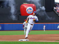 Pete Alonso #20 of the New York Mets rounds the bases after homering during the second inning in Game 3 of a baseball NL Division Series aga...