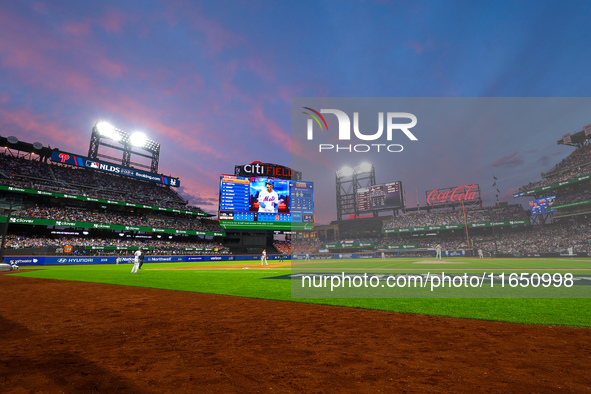 The evening sky appears during Game 3 of a baseball NL Division Series between the Philadelphia Phillies and the New York Mets at Citi Field...