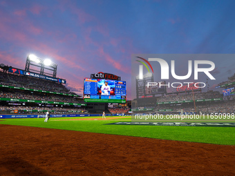 The evening sky appears during Game 3 of a baseball NL Division Series between the Philadelphia Phillies and the New York Mets at Citi Field...