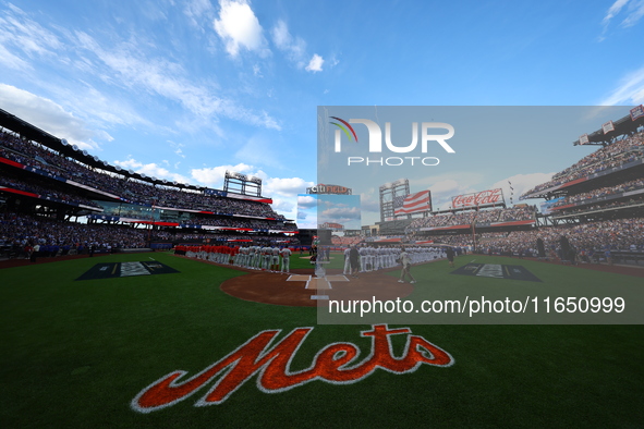 Players and staff of the Philadelphia Phillies and the New York Mets are introduced before Game 3 of a baseball NL Division Series at Citi F...