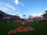 Players and staff of the Philadelphia Phillies and the New York Mets are introduced before Game 3 of a baseball NL Division Series at Citi F...