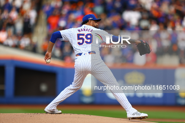 New York Mets starting pitcher Sean Manaea #59 throws during the first inning in Game 3 of a baseball NL Division Series against the Philade...