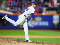 New York Mets relief pitcher Phil Maton #88 throws during the eighth inning in Game 3 of a baseball NL Division Series against the Philadelp...