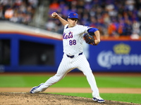 New York Mets relief pitcher Phil Maton #88 throws during the eighth inning in Game 3 of a baseball NL Division Series against the Philadelp...