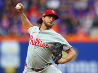 Philadelphia Phillies starting pitcher Aaron Nola #27 throws during the third inning in Game 3 of a baseball NL Division Series against the...