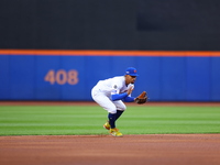 New York Mets shortstop Francisco Lindor #12 fields and throws during the first inning in Game 3 of a baseball NL Division Series against th...