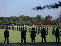 Nepal Army personnel stand in line preparing for the grand rehearsal of the Phulpati celebration at the army pavilion in Kathmandu, Nepal, o...