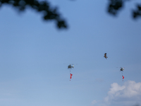 An eagle takes flight as a Nepal Army helicopter hoists the banner with wishes of Phulpati during the grand rehearsal in Nepal on October 8,...