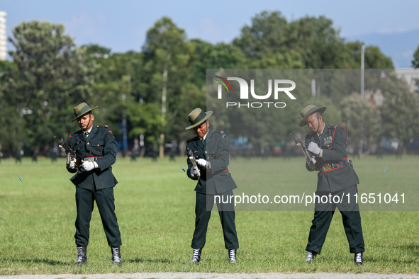 Nepal Army personnel clog their gun, preparing for another round of fire during the grand rehearsal of the Phulpati celebration at the army...