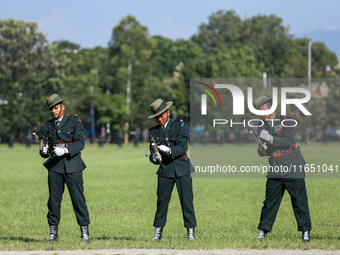 Nepal Army personnel clog their gun, preparing for another round of fire during the grand rehearsal of the Phulpati celebration at the army...