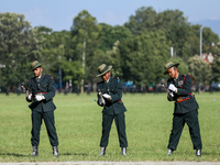 Nepal Army personnel clog their gun, preparing for another round of fire during the grand rehearsal of the Phulpati celebration at the army...