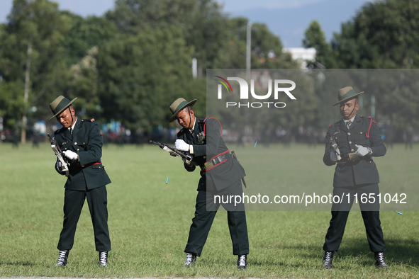 Nepal Army personnel clog their gun, preparing for another round of fire during the grand rehearsal of the Phulpati celebration at the army...