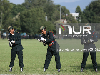 Nepal Army personnel clog their gun, preparing for another round of fire during the grand rehearsal of the Phulpati celebration at the army...