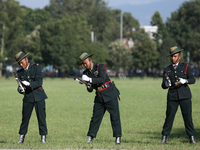 Nepal Army personnel clog their gun, preparing for another round of fire during the grand rehearsal of the Phulpati celebration at the army...