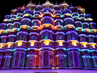 Visitors look at a makeshift place of worship made as a replica of the Hawa Mahal Palace during the Durga Puja festival celebration in Kolka...