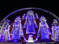 People gather at this 100-foot Hindu goddess Durga puja pandal, a temporary structure set up during the Durga Puja festival, near Kolkata, I...