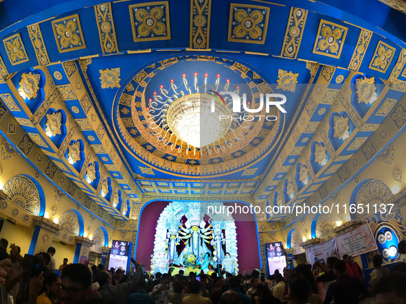 A Hindu Goddess Durga idol is inside the decoration of a puja pandal, a temporary structure set up during the Durga Puja festival in Kolkata...