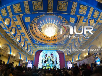 A Hindu Goddess Durga idol is inside the decoration of a puja pandal, a temporary structure set up during the Durga Puja festival in Kolkata...