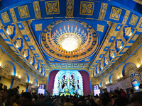 A Hindu Goddess Durga idol is inside the decoration of a puja pandal, a temporary structure set up during the Durga Puja festival in Kolkata...