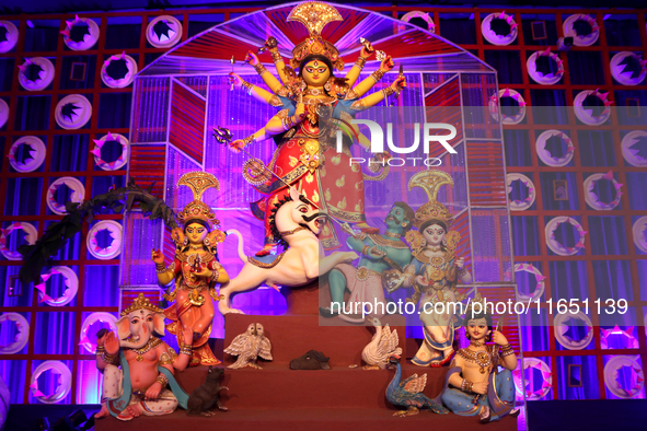 A Hindu Goddess Durga idol is inside the decoration of a puja pandal, a temporary structure set up during the Durga Puja festival in Kolkata...