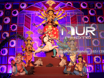 A Hindu Goddess Durga idol is inside the decoration of a puja pandal, a temporary structure set up during the Durga Puja festival in Kolkata...